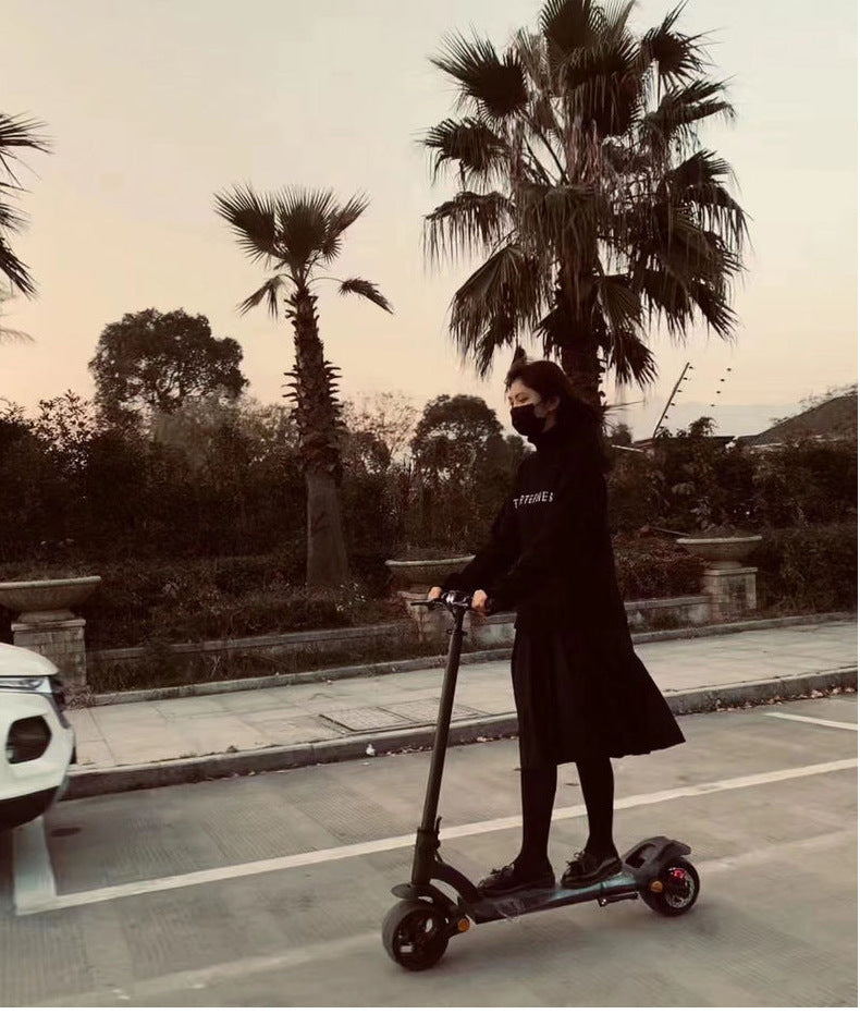 High-Performance Electric Scooter with 9-Inch Wide Tires - 36V Dual Drive Folding Design